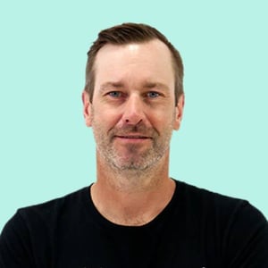 Tim-Glomb-Light-Blue-Headshot