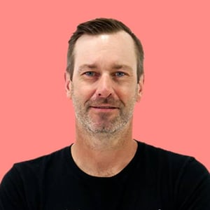 Tim-Glomb-Pink-Headshot